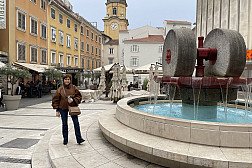 Sue Babich next to a fountain in Croatia