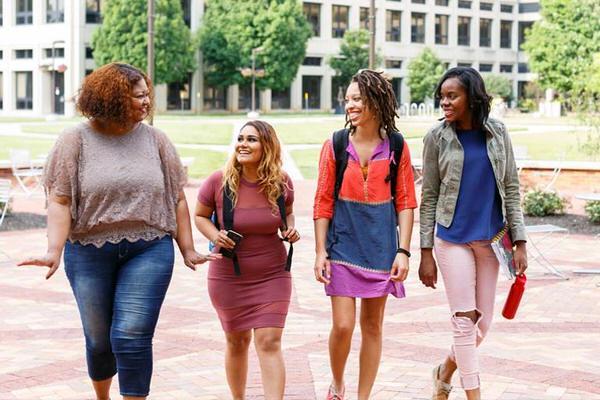 Group of female undergraduate students walking on IUPUI's campus.